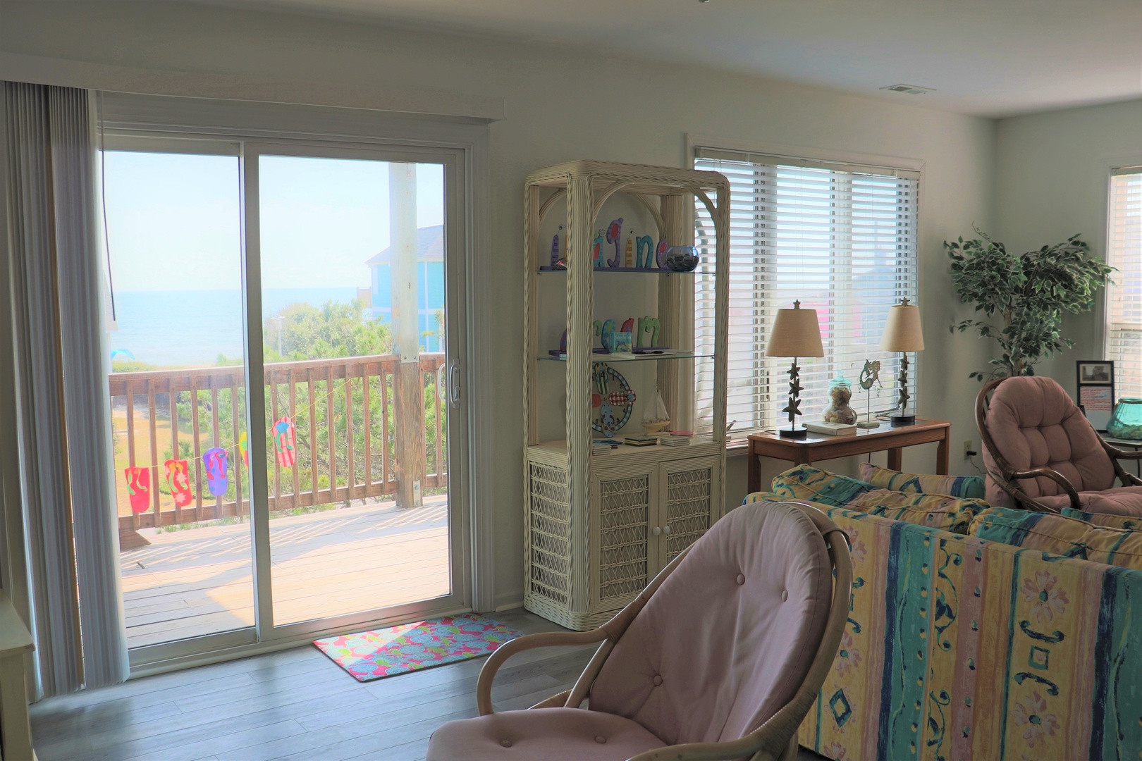 Relax in your bright living space with sea views through sliding doors to your private balcony.