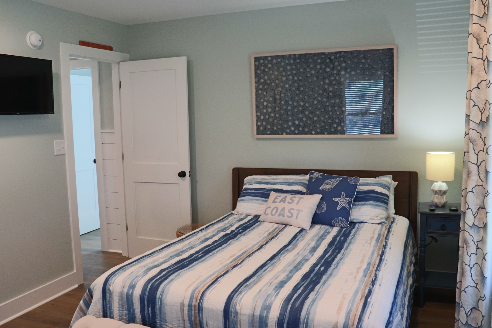 Drift off in this cozy bedroom with coastal charm, where soft blue hues and nautical touches create your perfect seaside retreat.