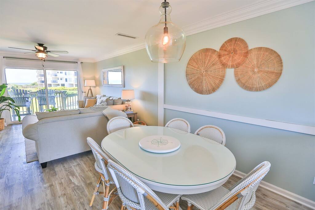 Gather around your spacious dining table for memorable meals while soft ocean breezes flow through your coastal retreat.