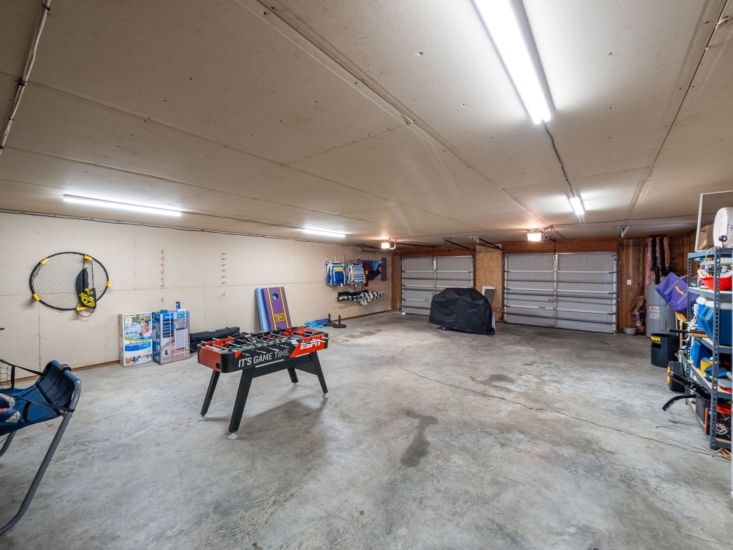 Your private garage game room features foosball fun and recreational gear, perfect for entertaining during your stay.