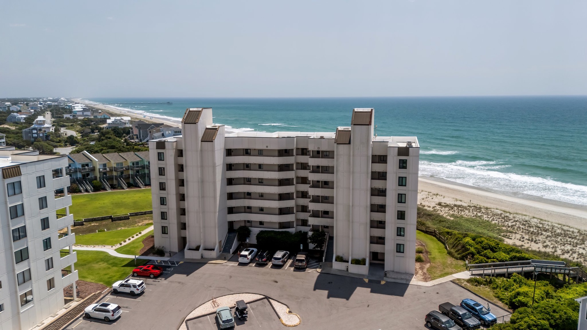 Beachfront resort towers offer stunning ocean views and direct beach access on pristine coastline.