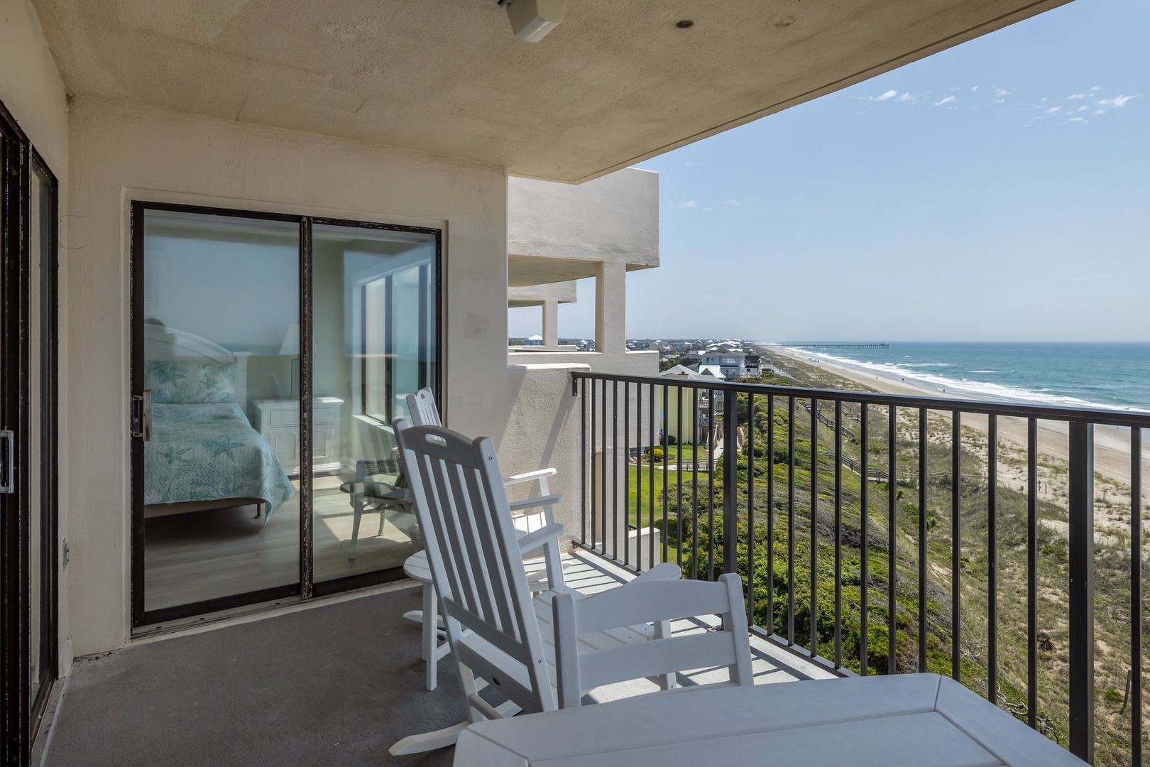 Your private oceanfront balcony offers stunning sea views where you can unwind in comfortable chairs and watch waves roll endlessly to shore.
