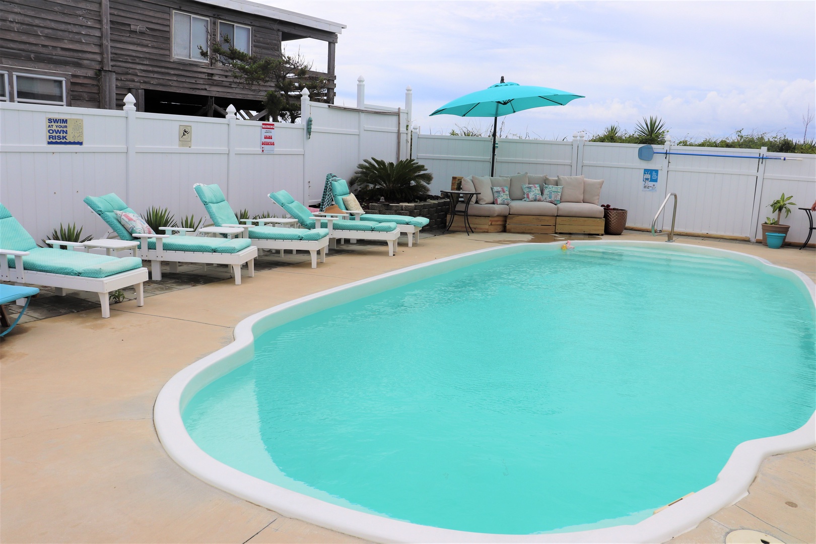 Slip into turquoise waters and unwind on cushioned loungers. Your private poolside retreat awaits with shaded seating and tropical ambiance.