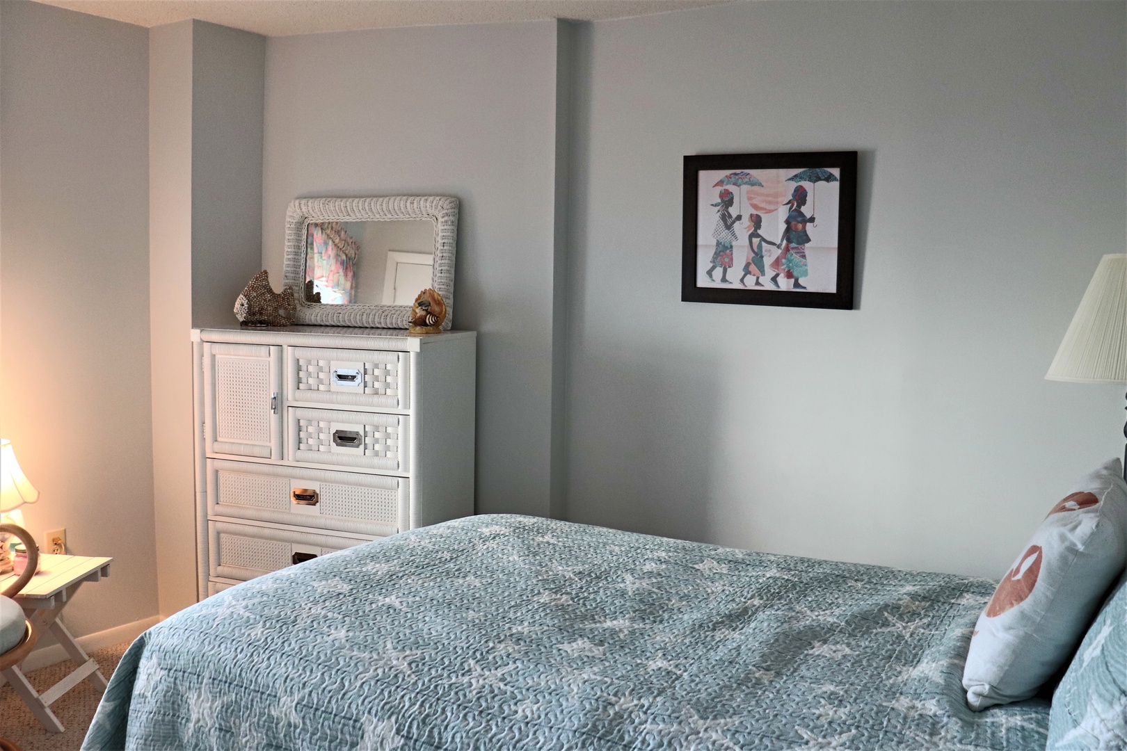 Your peaceful bedroom sanctuary features soft blue tones, cozy textured bedding, and thoughtful touches that create the perfect retreat for restful nights.