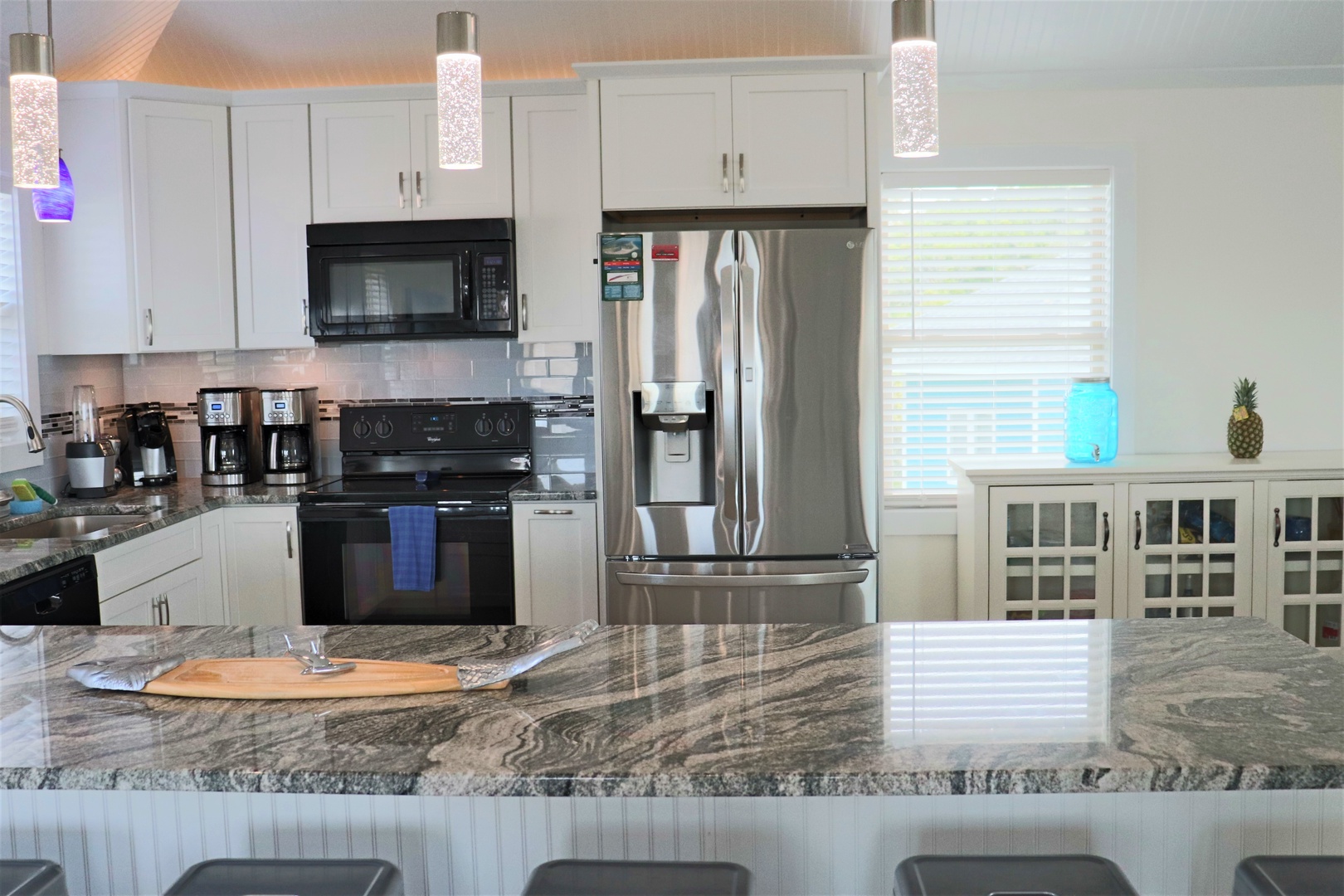 Your fully-equipped kitchen features granite counters, stainless appliances, and everything you need to create memorable meals during your stay.