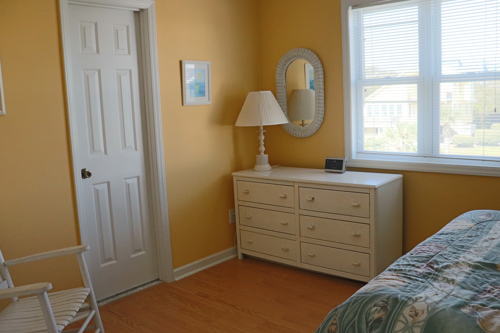 Rest in your bright, cheerful bedroom with warm golden walls and plenty of storage space for all your belongings.