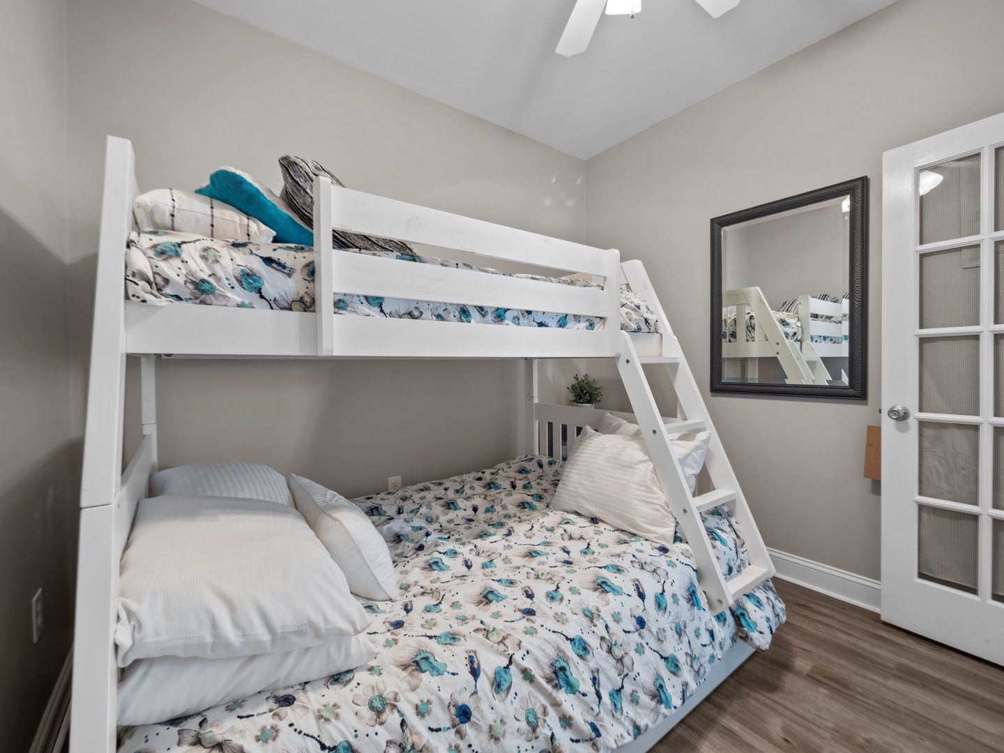 Your kids will love this bright bunk room with cheerful bedding and plenty of space to play and rest after adventure-filled days.