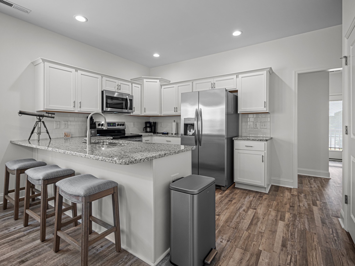 Your modern kitchen features granite countertops, stainless appliances, and a convenient breakfast bar where you'll love starting each morning with coffee.