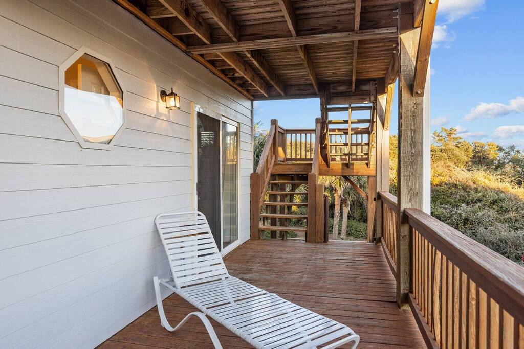 Unwind on your private deck with treetop views, where warm wood tones and peaceful surroundings create the perfect retreat.