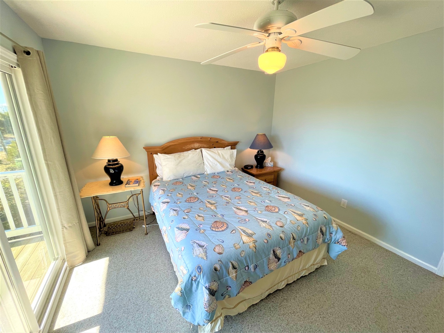 Drift off to sleep in your peaceful bedroom, where soft sea-shell bedding and gentle ceiling fan breezes create the perfect coastal retreat.