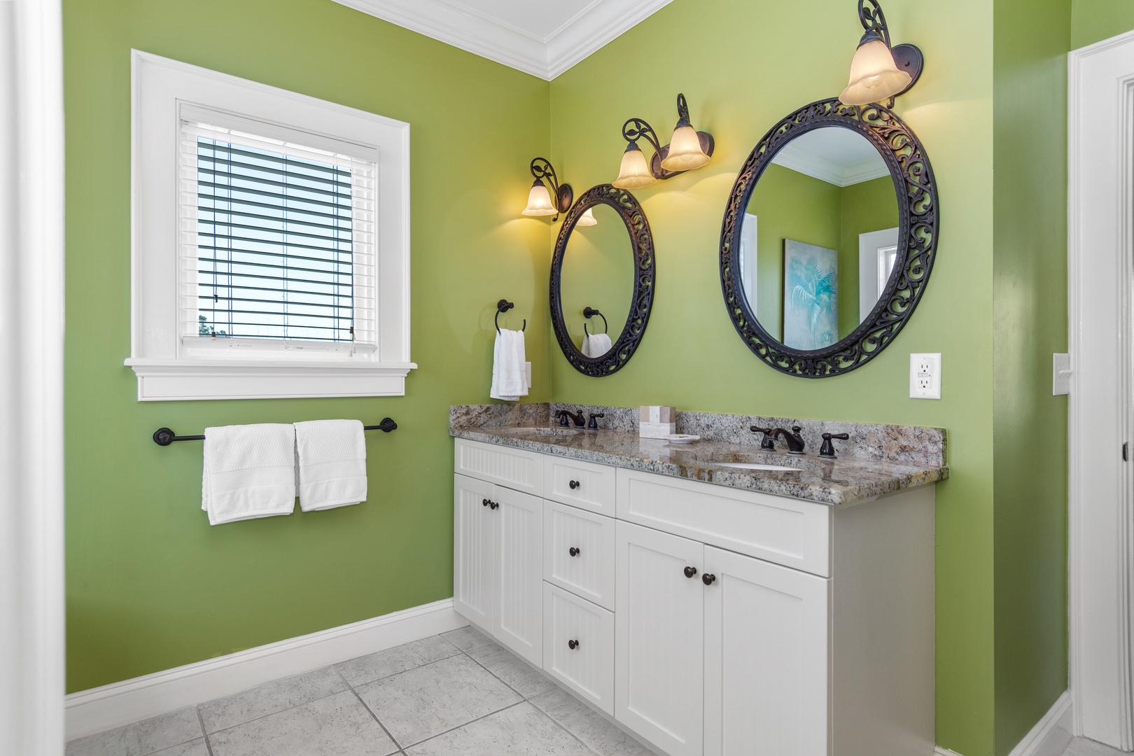 Refresh in your vibrant bathroom with dual vanities, granite counters, and warm lighting that makes every morning routine feel luxurious.