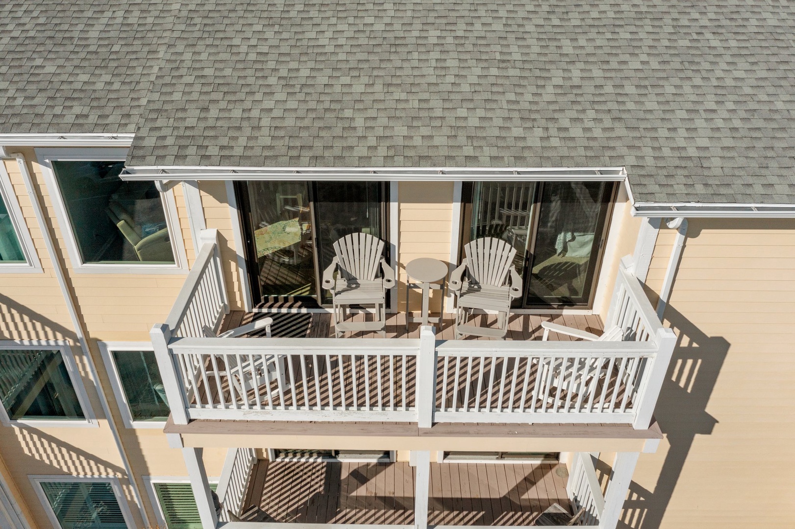 Your private balcony awaits with comfortable outdoor seating and sliding door access from your room.