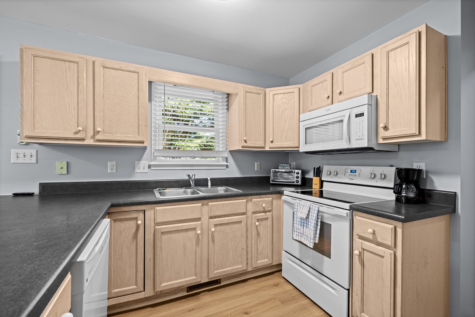 Your fully equipped kitchen awaits with sleek appliances and ample counter space for cooking memorable meals together.