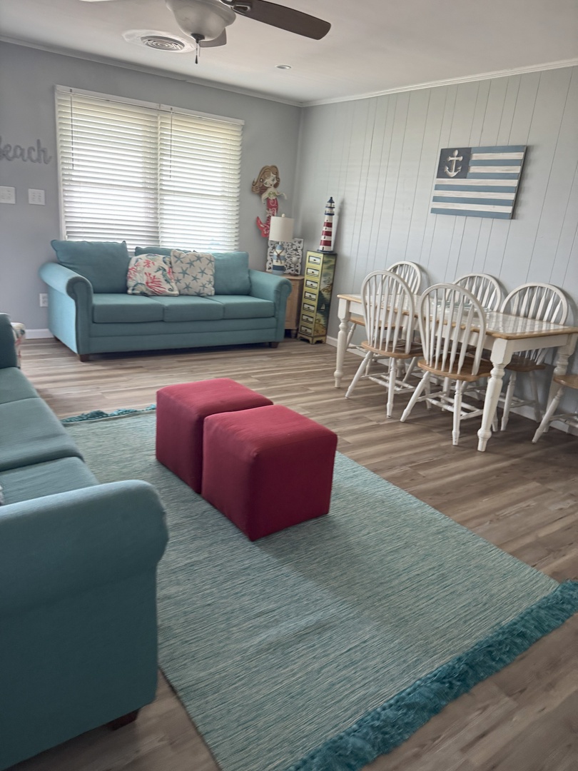 Your coastal-themed living space combines comfort with nautical charm, featuring plush seating and dining for memorable beachside meals together.