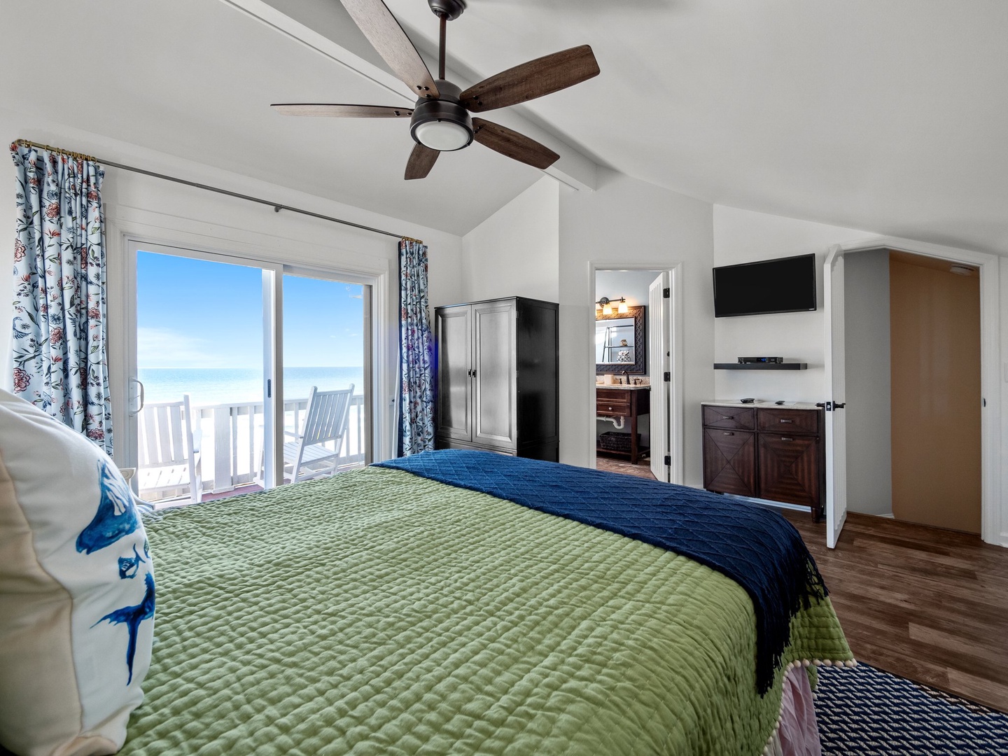 Wake up to ocean views from your comfortable bed, with a private balcony and ceiling fan for perfect coastal comfort.