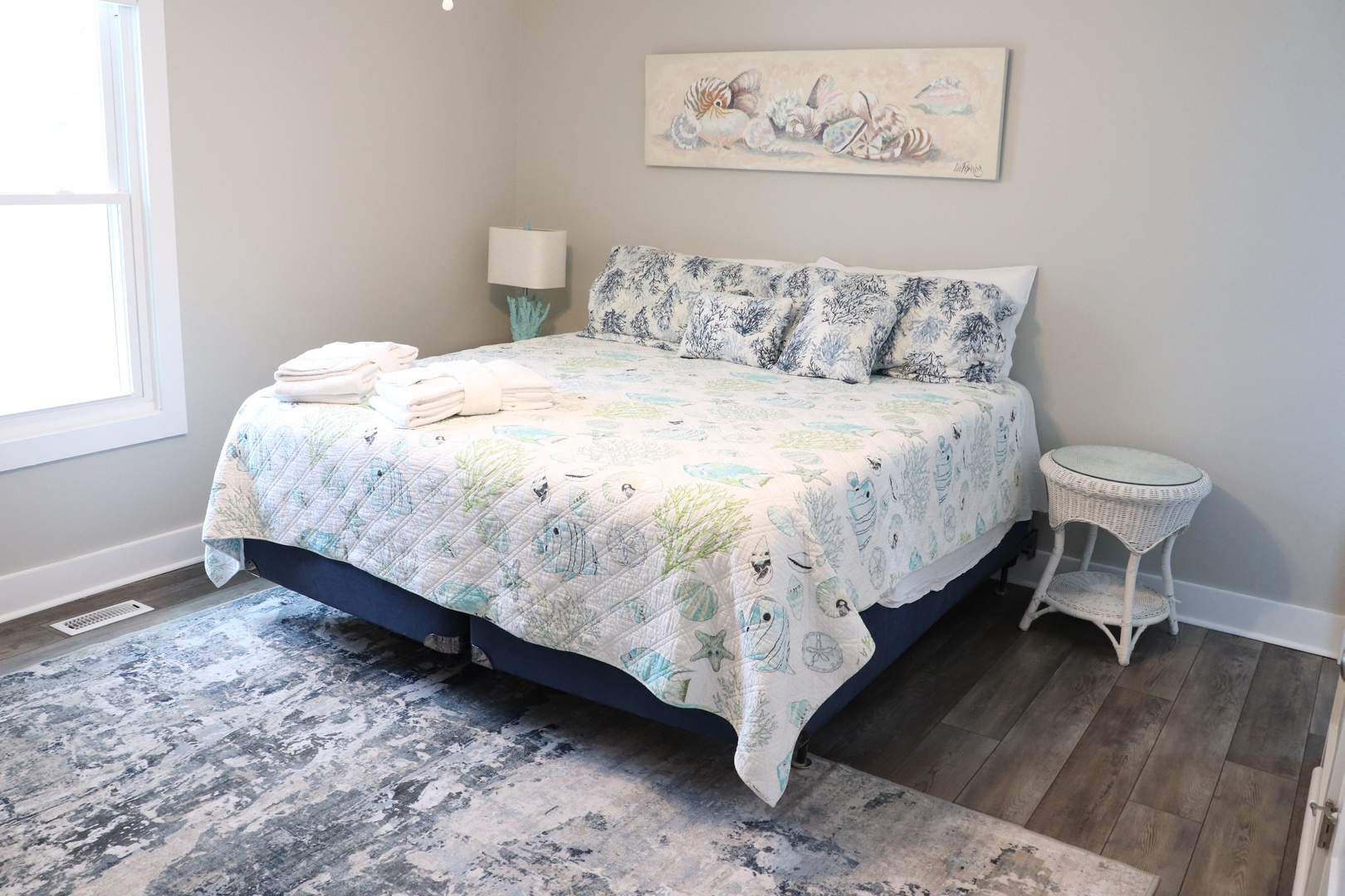 Drift off in your ocean-themed bedroom with crisp linens, coastal artwork, and gentle natural light streaming through.