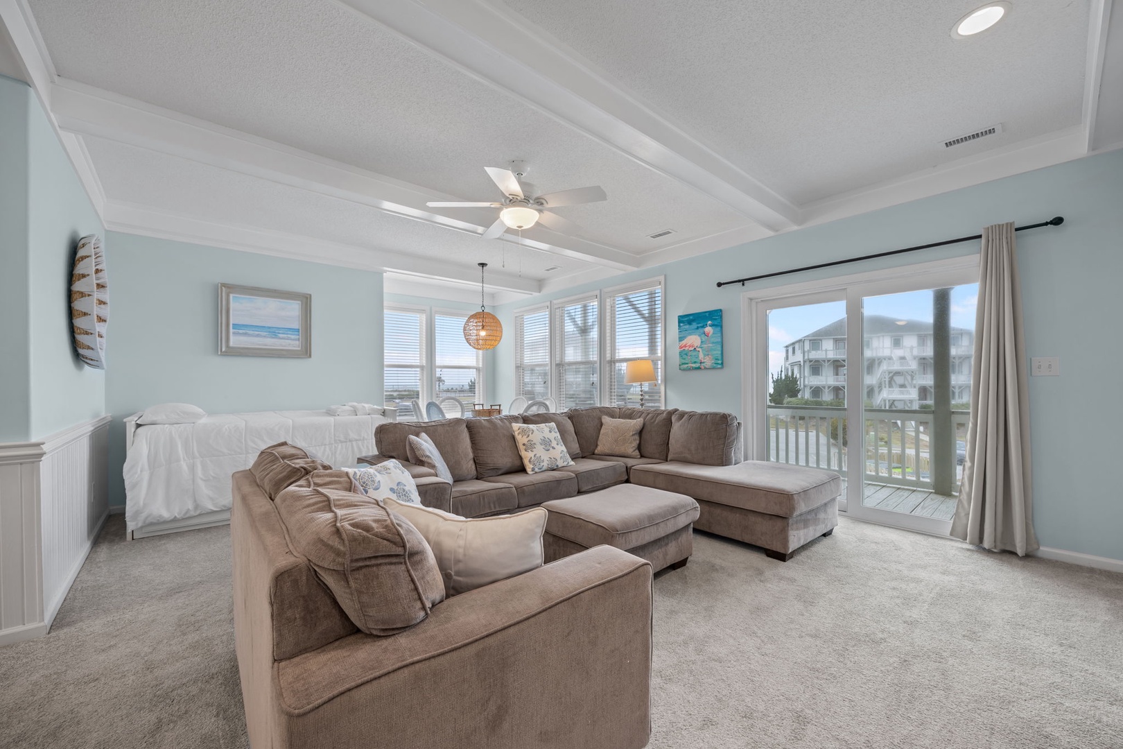 Sink into plush sectional seating while gentle breezes flow through your bright, airy living space with stunning views.