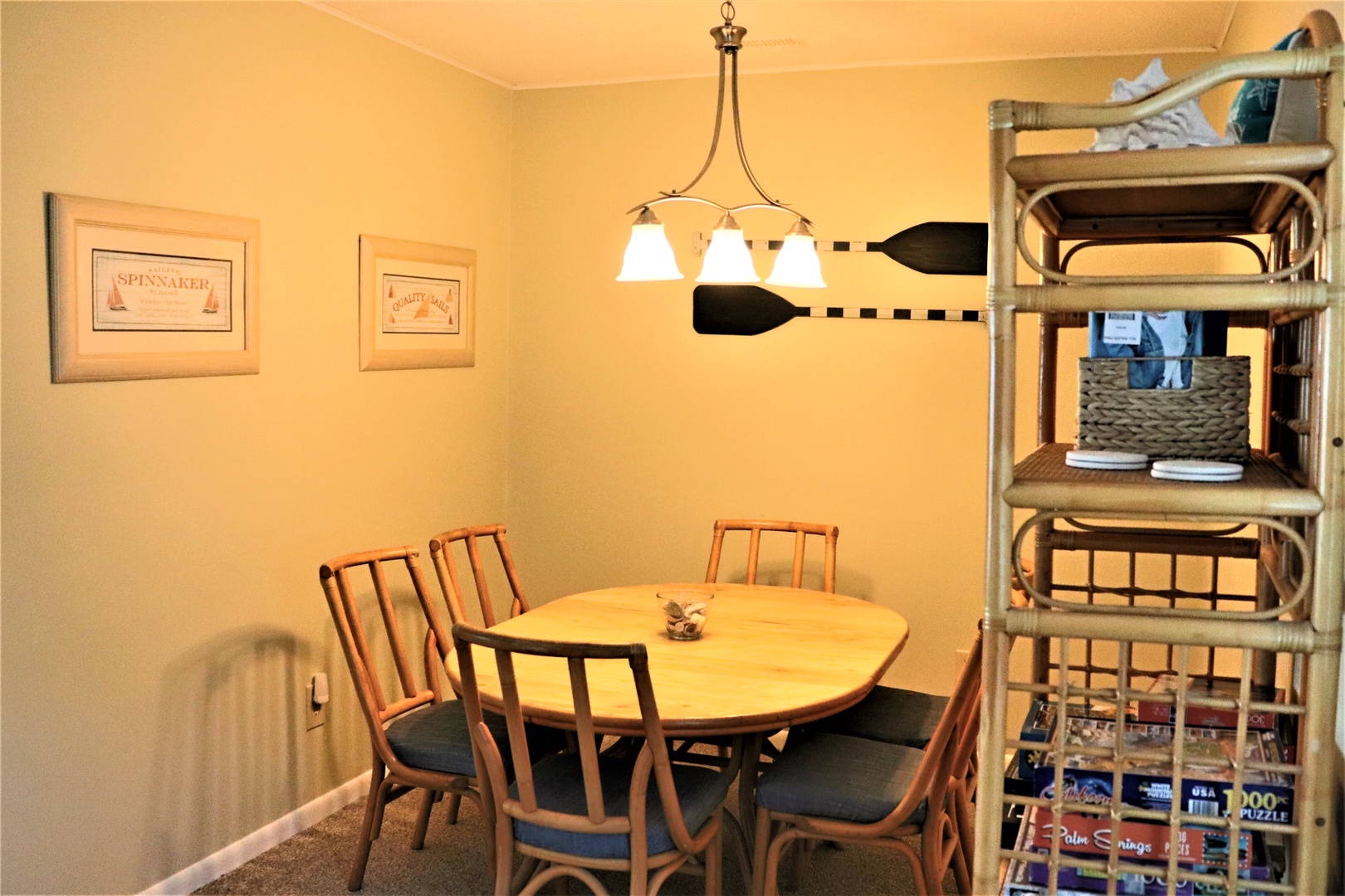 Gather around your inviting dining table for memorable meals with family and friends in this warm, nautical-themed space.