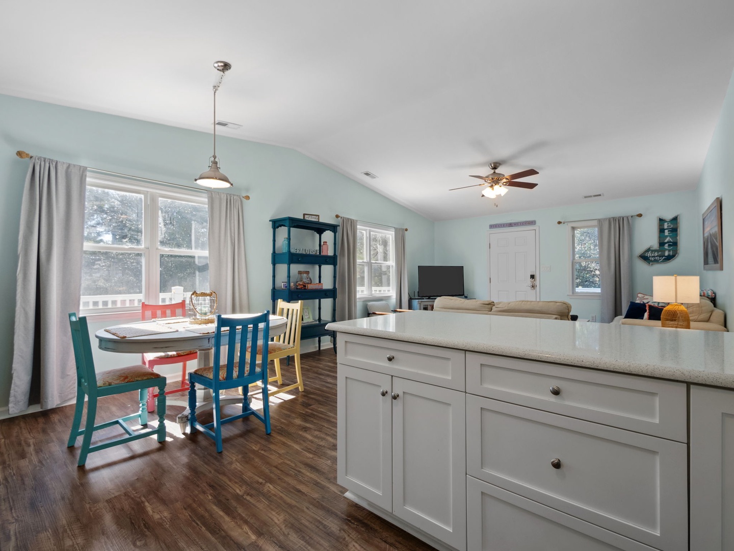 Bright open-concept living with coastal charm - your kitchen island flows into dining and lounge areas for effortless entertaining.