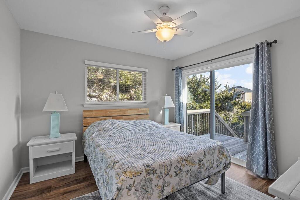 Drift off to peaceful sleep in your cozy bedroom, where morning light streams through windows and gentle breezes from your private balcony.