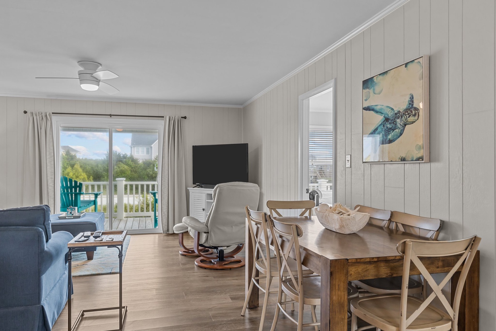 Your coastal retreat features open living with ocean-inspired decor, comfortable seating, and a balcony where gentle breezes await.