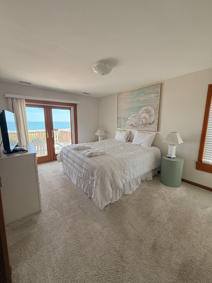 Wake up to the sound of waves and step onto your private balcony for stunning ocean views. Crisp linens and beach-inspired decor make this your perfect seaside retreat.