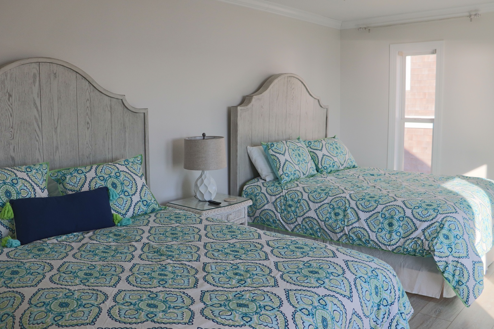 Drift into peaceful dreams in your serene twin bedroom with matching paisley bedding and soft morning light.