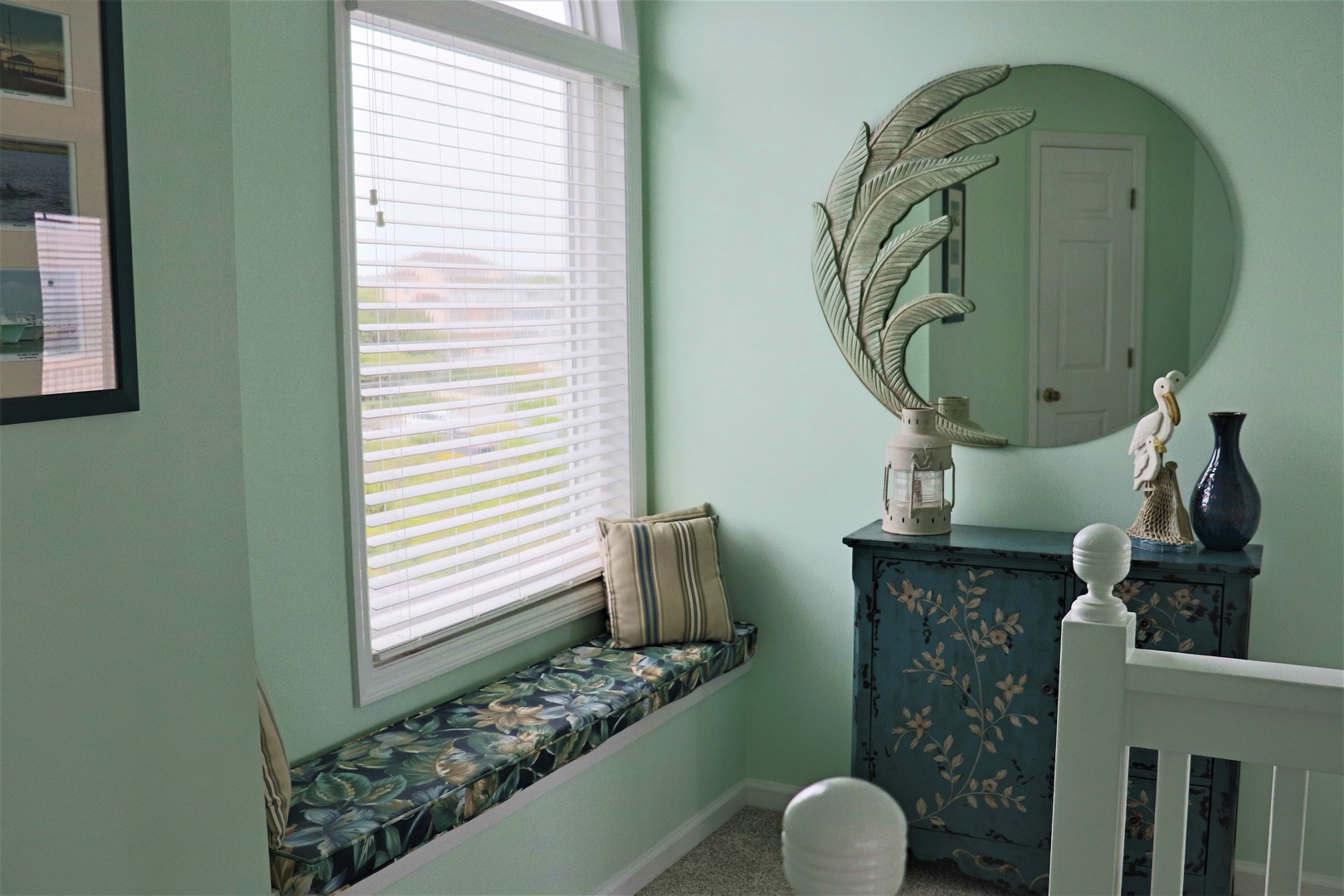 Curl up in your cozy window nook with soft cushions, perfect for morning coffee or watching the world outside.