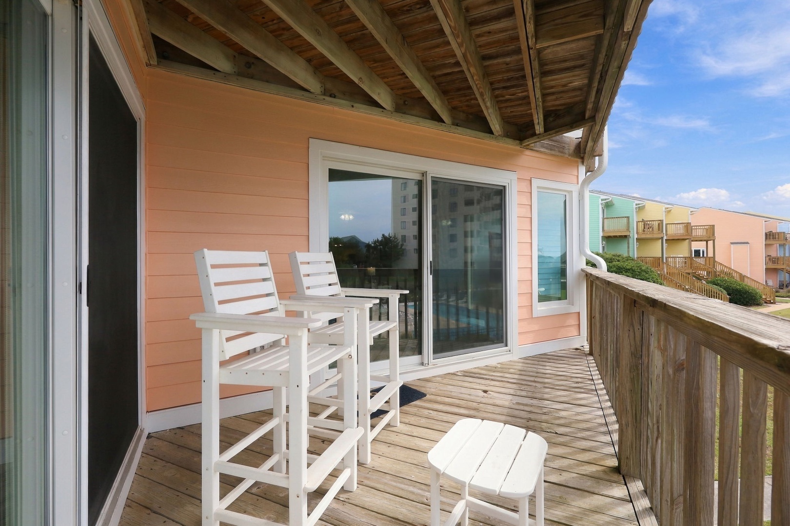 This welcoming balcony offers your own private outdoor retreat with comfortable seating and peaceful coastal surroundings. Sip your morning coffee as ocean breezes refresh you beneath the sheltering overhead, perfect for relaxing any time of day.