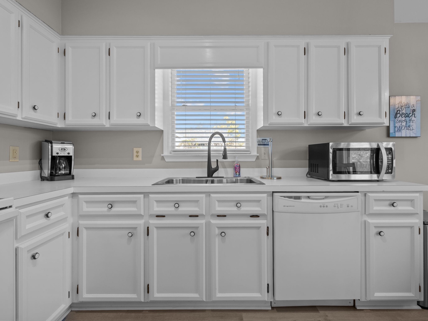Your bright, fully-equipped kitchen features modern appliances and ample cabinet space for all your culinary adventures.