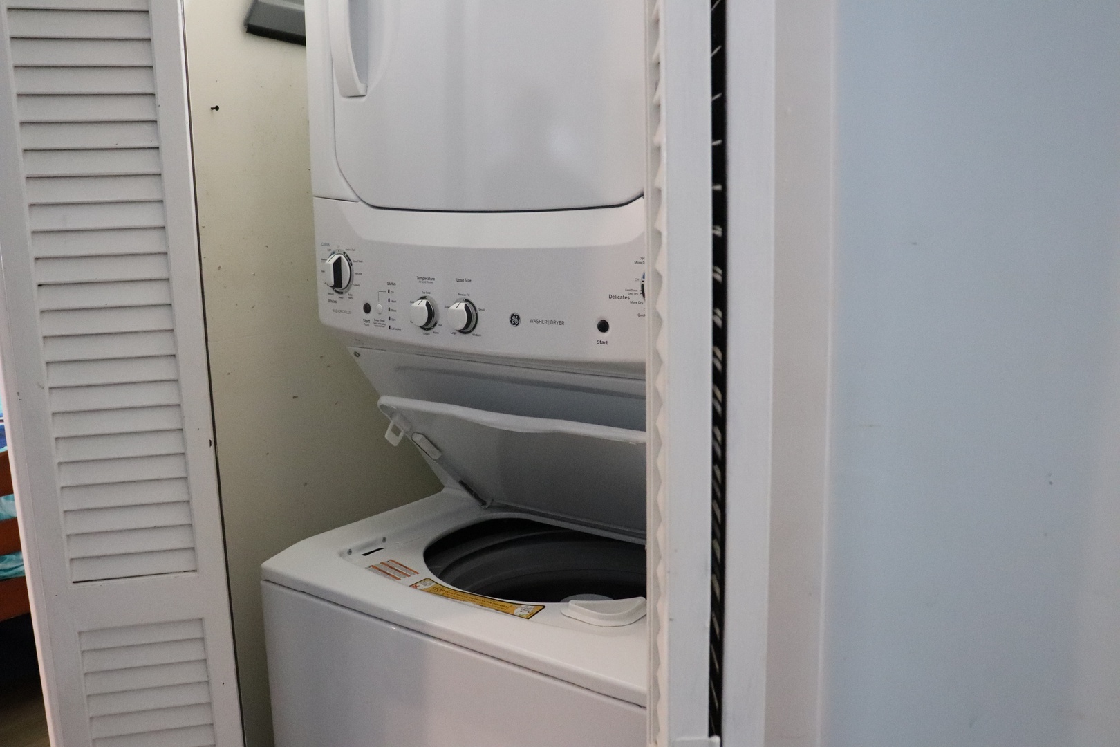 A stacked washer and dryer tucked neatly in your unit means you can pack light and refresh clothes anytime during your stay.