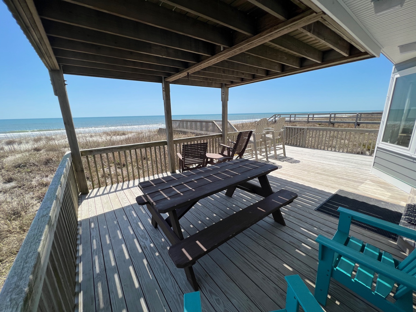 Relax on your private oceanfront deck with breathtaking sea views and comfortable seating for morning coffee or sunset meals.