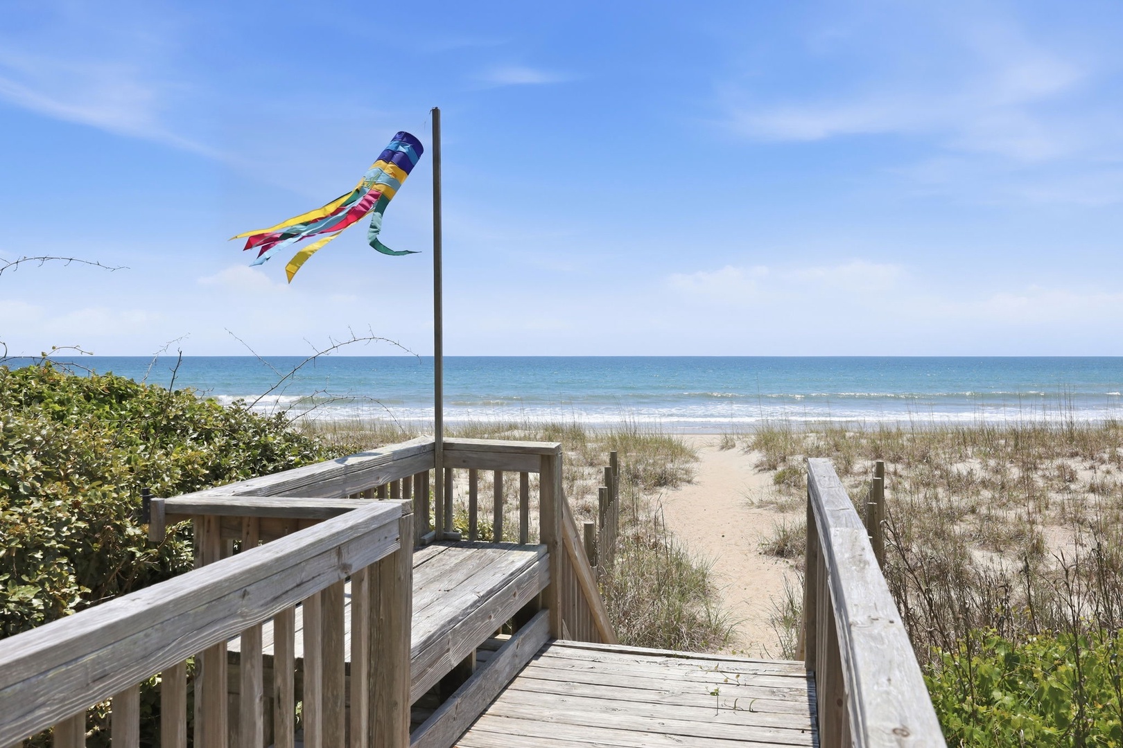 This beachfront deck offers direct access to soft sand and rolling waves, with coastal breezes and endless ocean views framing your private seaside escape.