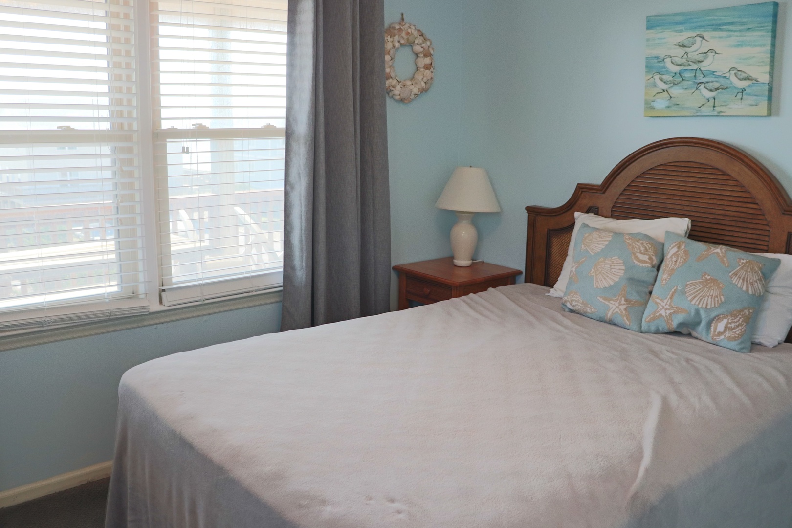 Wake up refreshed in your coastal-inspired bedroom, where gentle ocean hues and seashell accents create a tranquil beachside retreat.