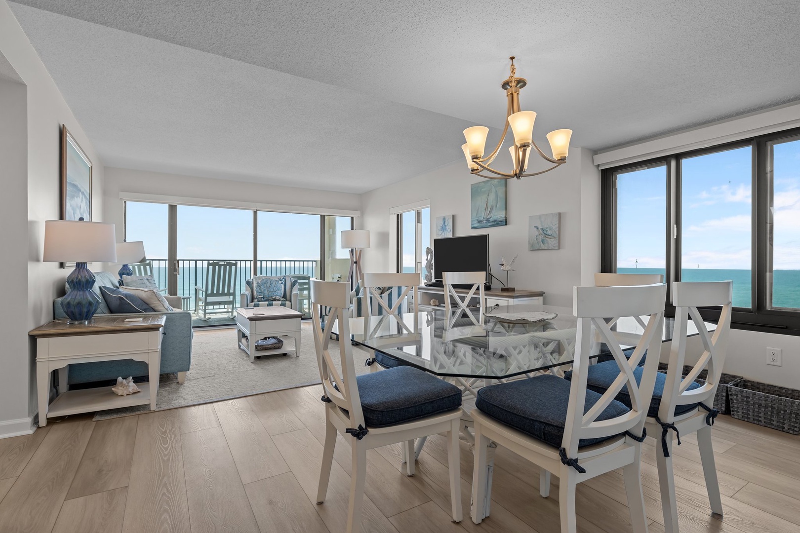Soak in stunning ocean views from your bright, open living space with elegant coastal decor and seamless flow to the private balcony.