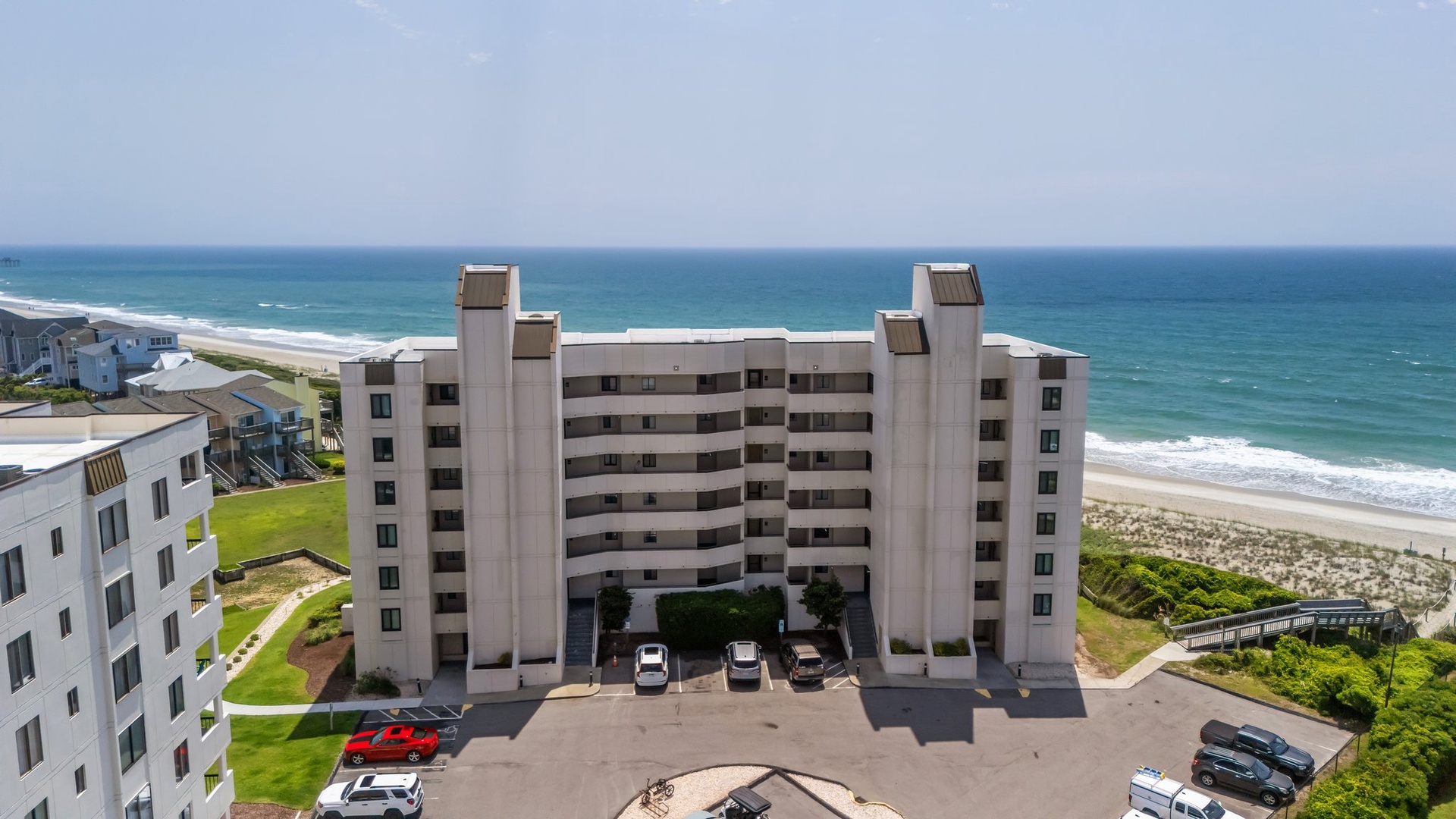 Oceanfront high-rise property with direct beach access and pristine coastal setting.