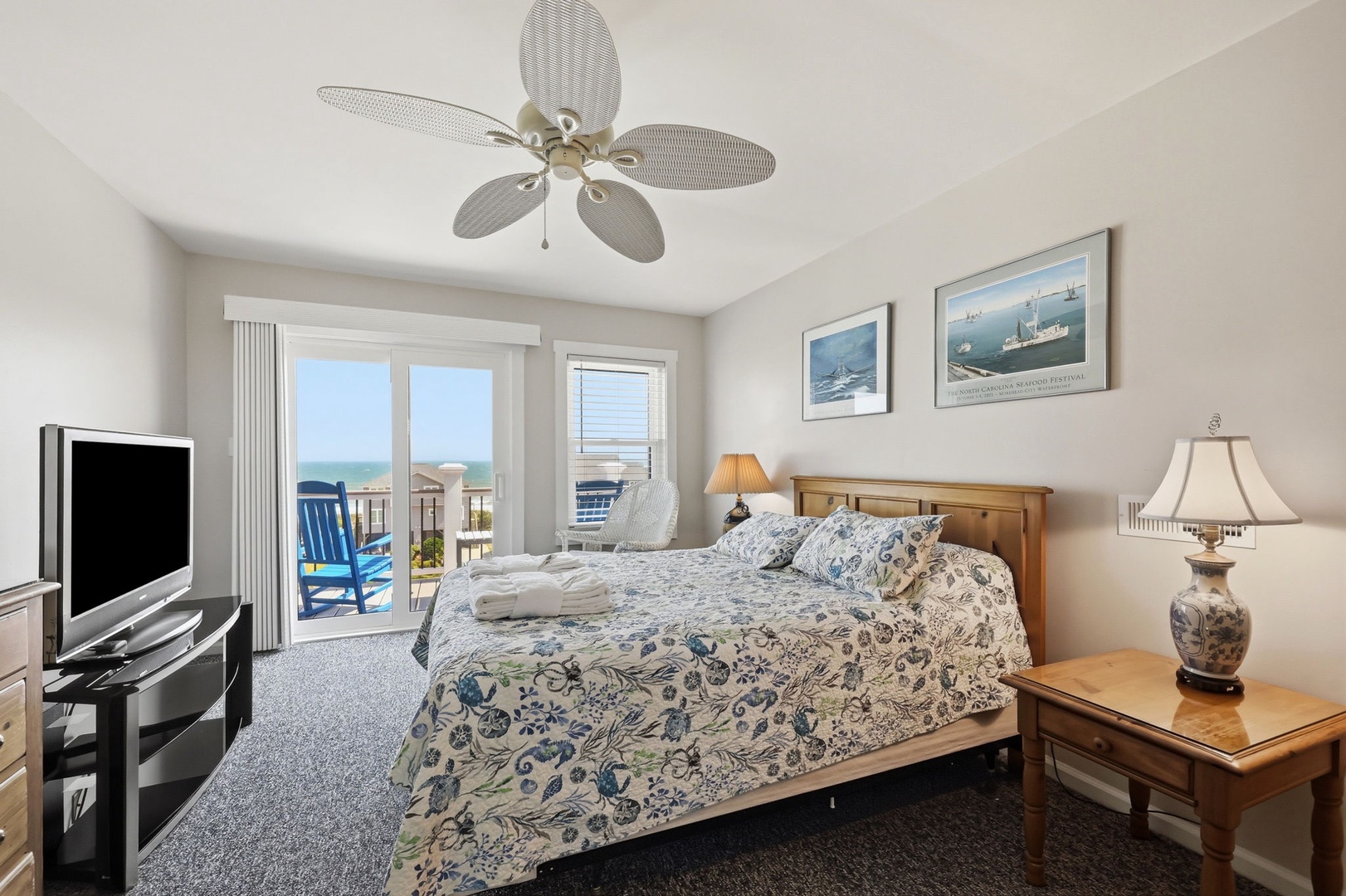 Wake to ocean breezes and endless blue horizons through your private balcony doors, where coastal charm meets comfort in every detail of your serene retreat.