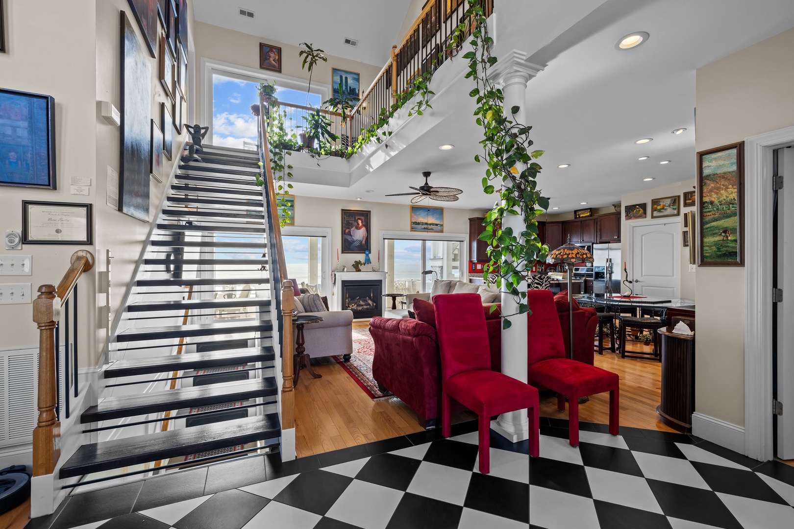 Your elegant duplex awaits with soaring ceilings, rich red velvet seating, and a gourmet kitchen where memorable meals come to life.