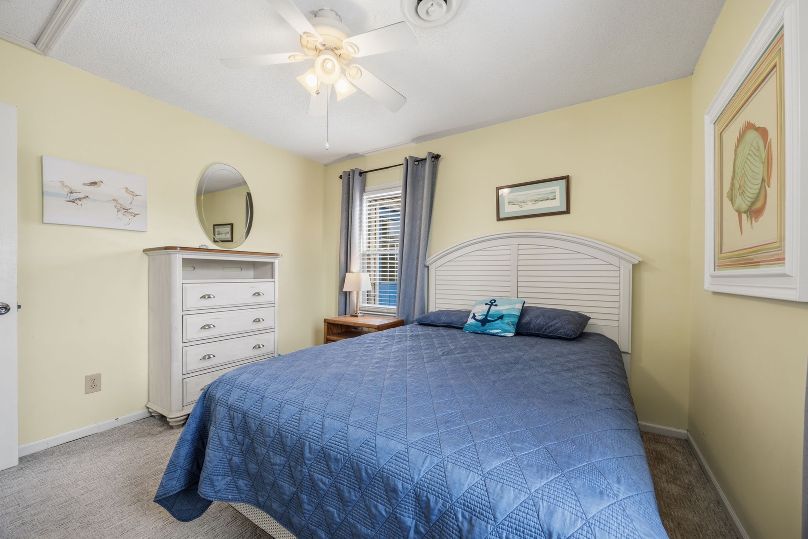 Drift off in your cozy bedroom featuring coastal charm, crisp linens, and thoughtful touches that make you feel right at home.
