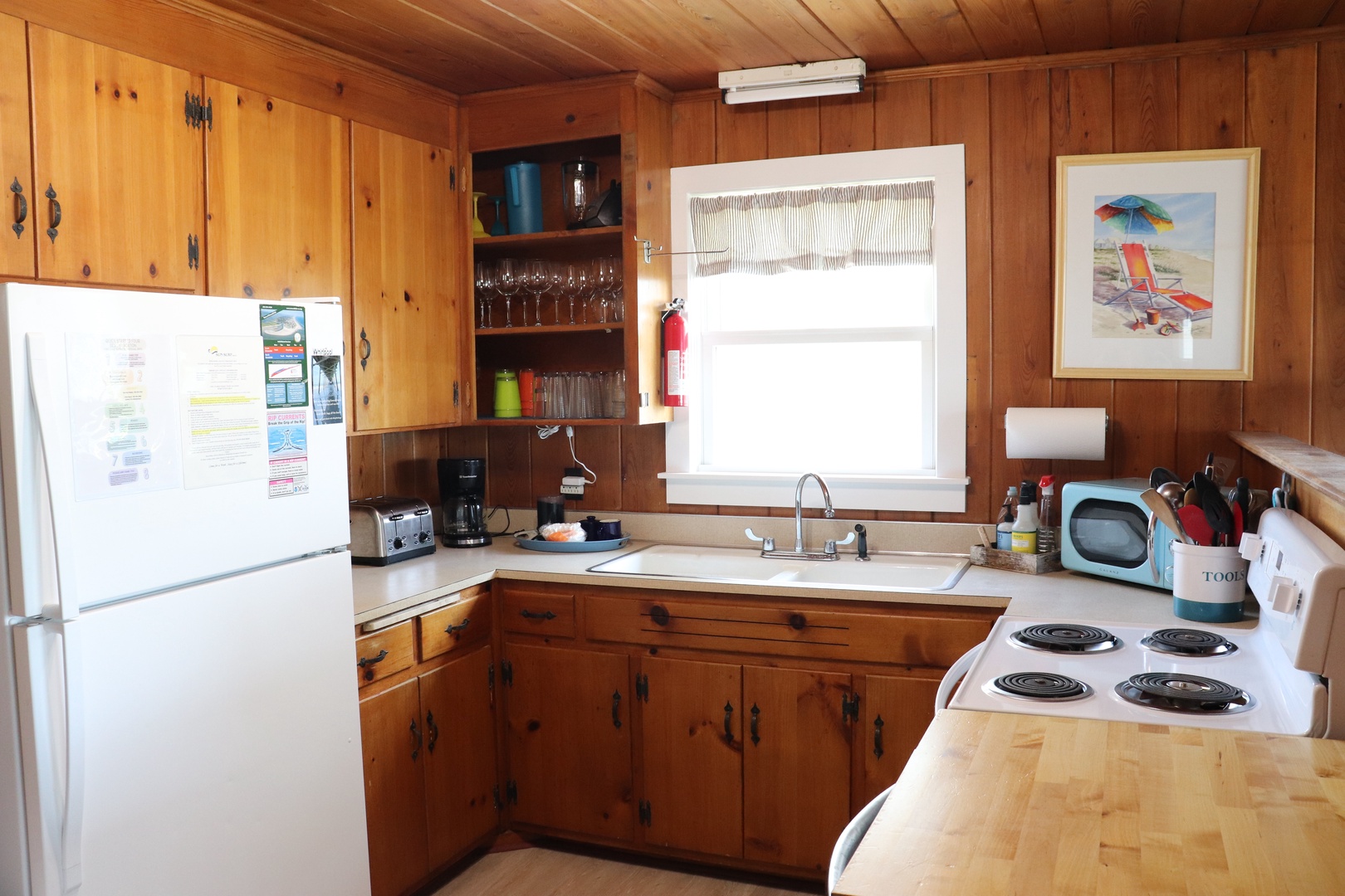 Your fully-equipped kitchen features warm knotty pine cabinets, full-size appliances, and everything you need to create memorable meals during your stay.