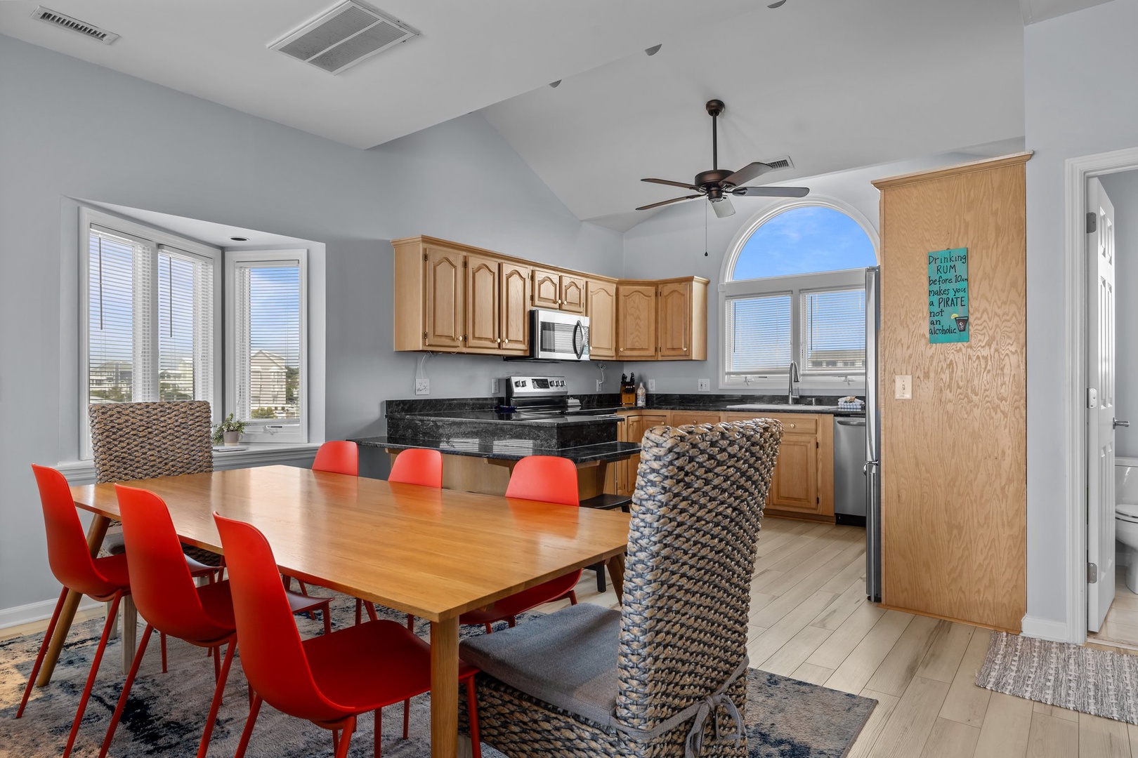 Your bright open kitchen and dining space features modern appliances and seating for eight, perfect for memorable group meals together.