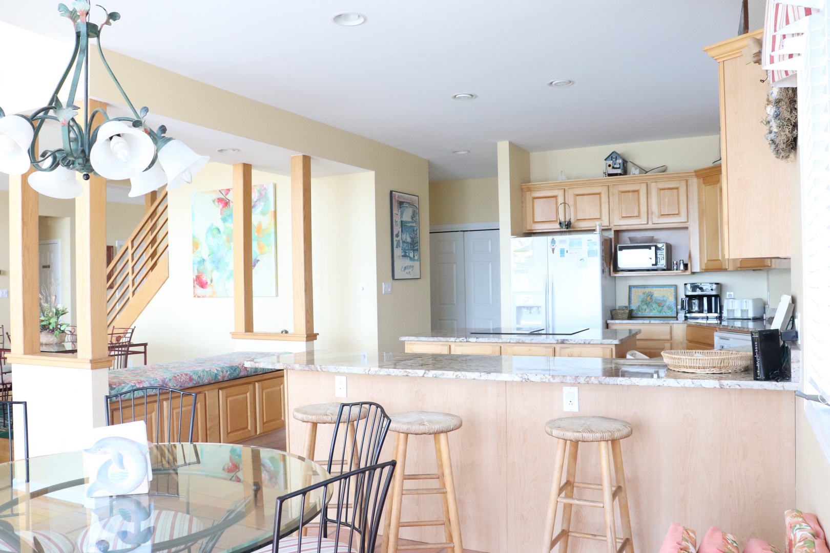 Your spacious kitchen opens to the dining area, creating perfect flow for cooking and entertaining with warm wood details throughout.