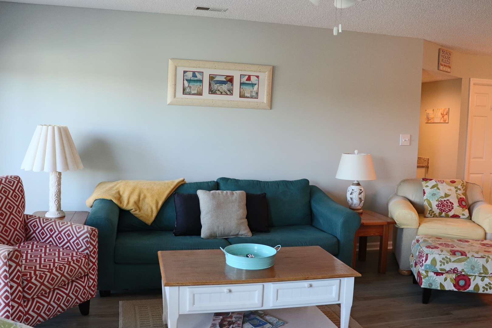 Settle into your bright living room with colorful furnishings, perfect for relaxing after beach adventures.