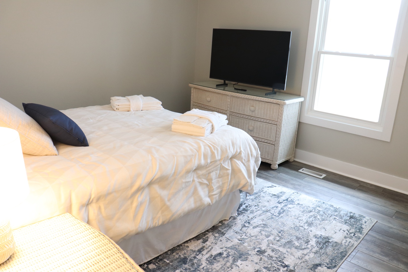 Unwind in your cozy bedroom with crisp linens, plush towels, and entertainment at your fingertips.