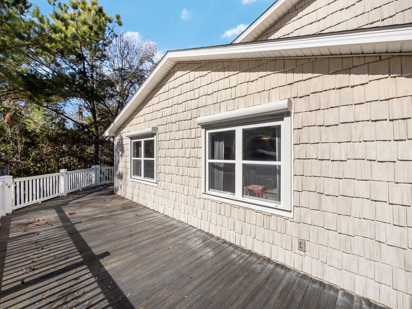 Step onto your private deck and breathe in the fresh air while enjoying peaceful views of the surrounding trees.