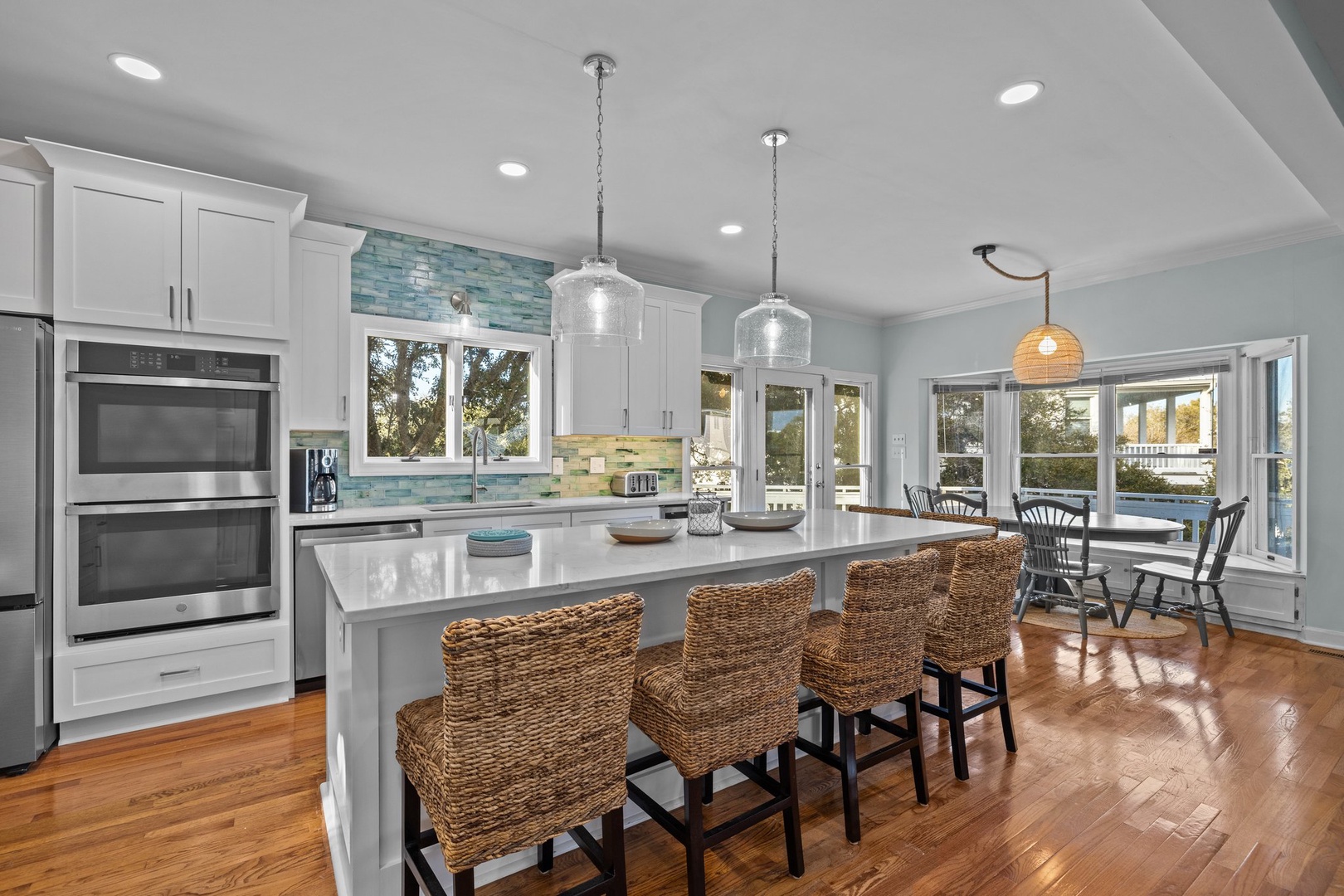 You'll love cooking in this bright, modern kitchen with coastal-inspired touches and a spacious island perfect for gathering with friends.