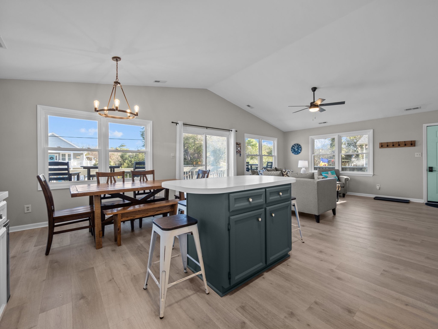 Gather around your spacious kitchen island while natural light streams through panoramic windows, creating the perfect backdrop for memorable meals together.