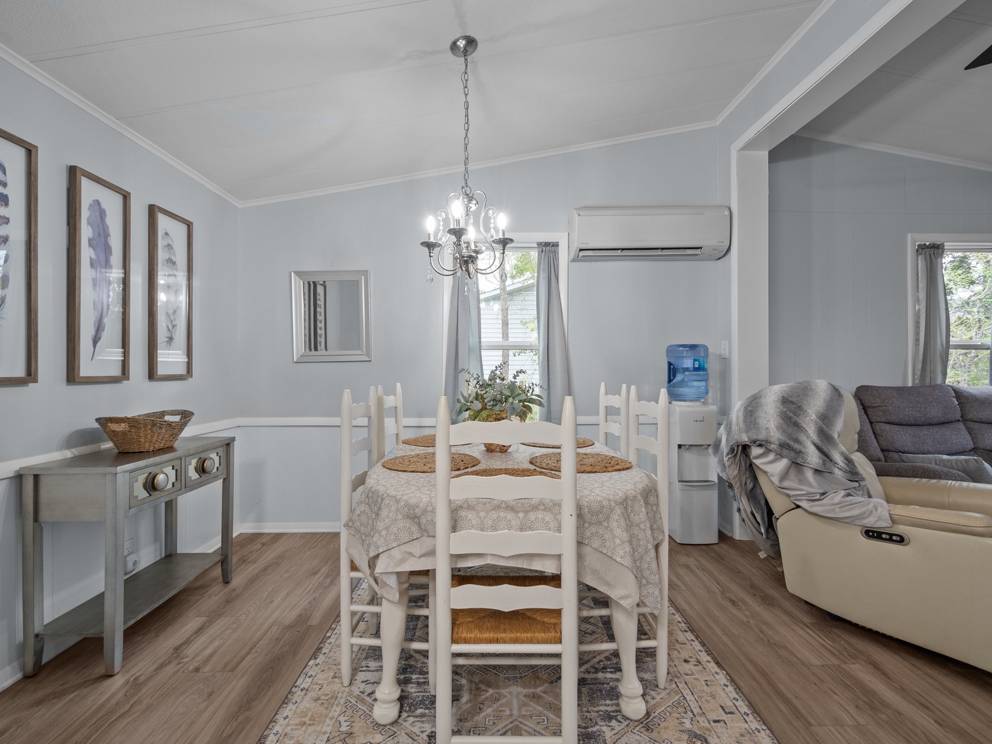 Gather around your elegant dining table beneath a charming chandelier, with comfortable seating and climate-controlled comfort for memorable meals together.