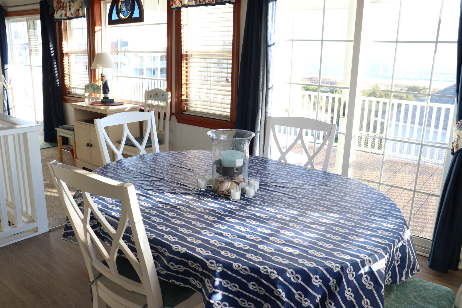 Your bright dining space opens to a private balcony overlooking peaceful neighborhood views, perfect for morning coffee or evening meals.