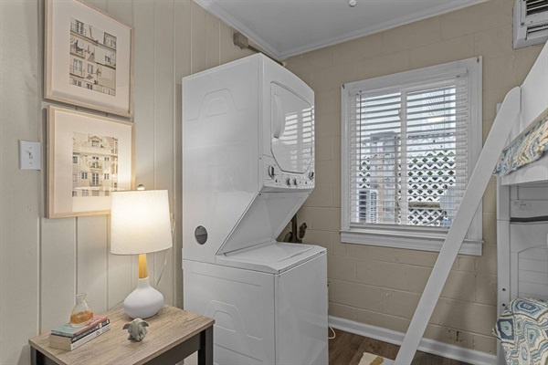 Your in-unit laundry setup makes extended stays effortless, with stackable washer and dryer tucked into this bright, organized space.